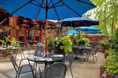 Outdoor patio tables with umbrellas at Barcelona in German Village