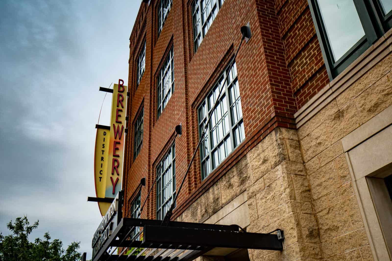 Brick building with a Brewery District sign on the side